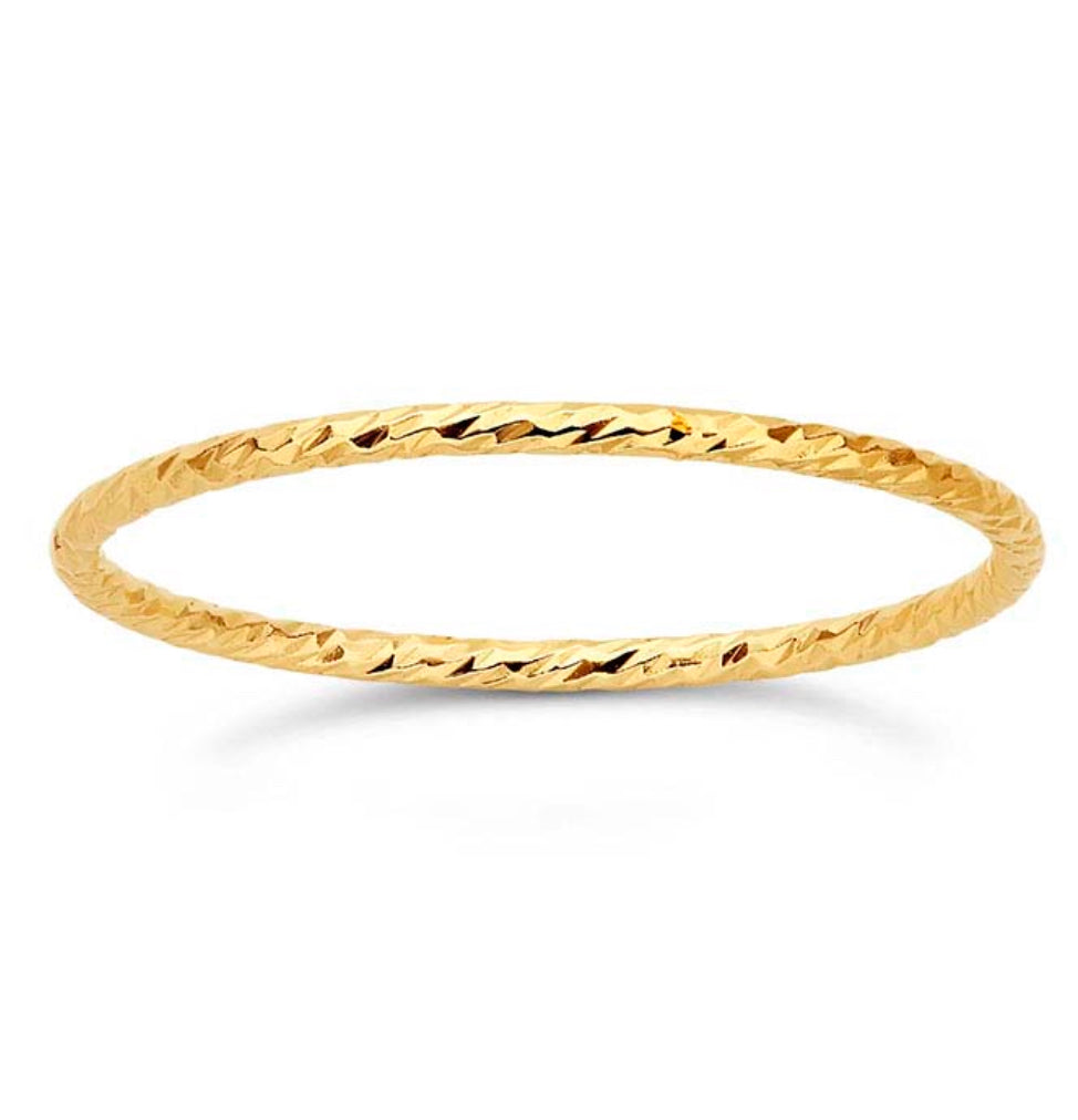 Gold filled dainty sparkle ring on white background.