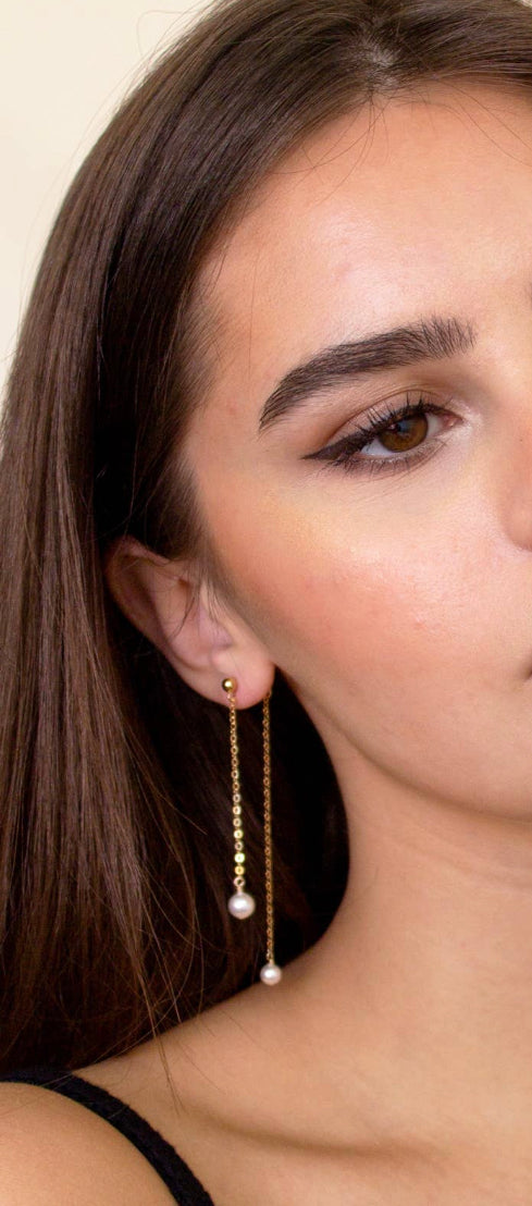 model wearing gold filled earrings. 2 inch chain with freshwater pearl attached.